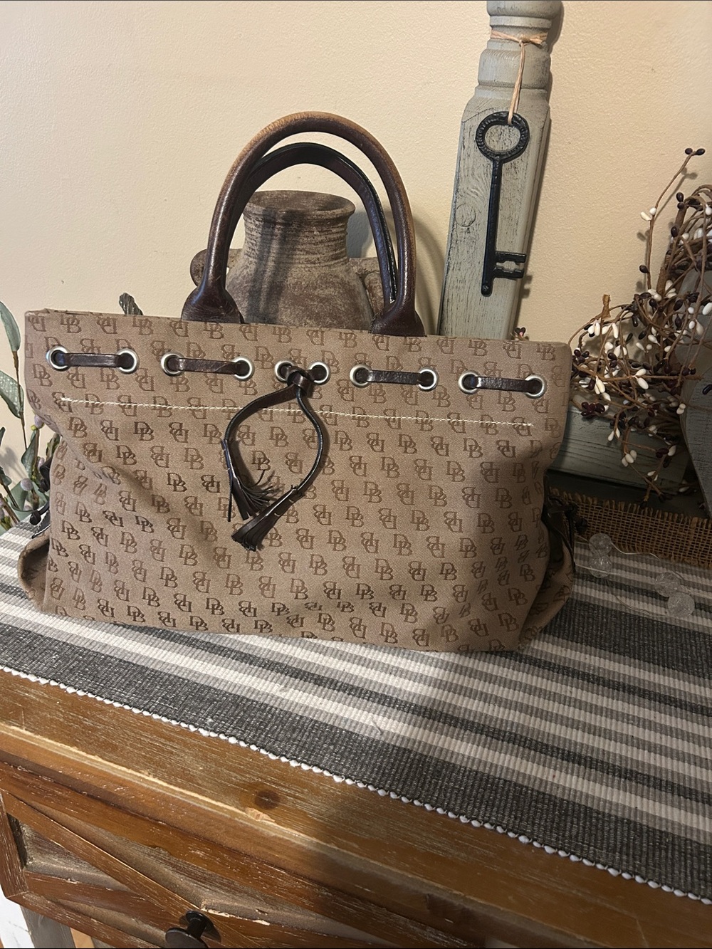 Dooney & Bourke Vintage Brown Monogram Drawstring Tote with Dark Brown Handles